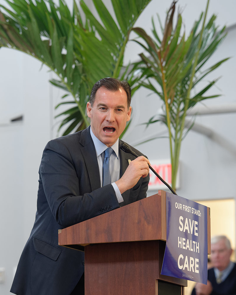 Westbury, New York, USA. January 15, 2017. Representative THOMAS SUOZZI (Democrat - 3rd Congressional District NY), standing on stage speaking at podium, is one of the hosts at the "Our First Stand" Rally against Republicans repealing the Affordable Care Act, ACA, taking millions of people off health insurance, making massive cuts to Medicaid, and defunding Palnned Parenthood. Rep. K. Rice (Democrat - 4th Congressional District) was also a host.