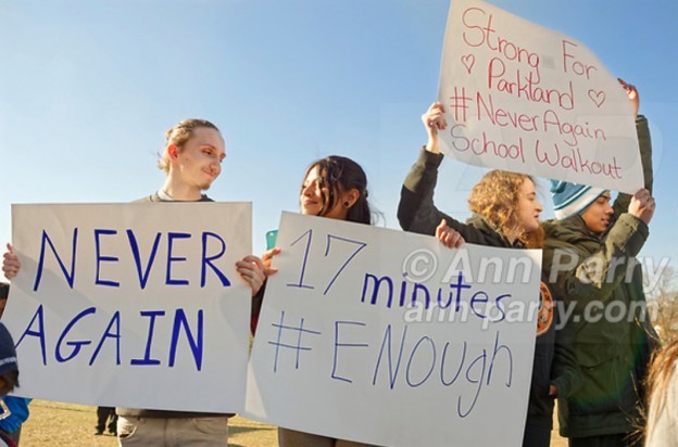 North Bellmore; New York; USA. March 14; 2018. Protesting gun violence, Mepham High School students walk out of class for 17 minutes; starting 10:00 am EST; one minute for each student shot and killed last month in a Parkland, Florida, H.S. It was part of a nationwide walkout in solidarity with student shooting victims, and a demand for U.S. laws to reduce gun violence.