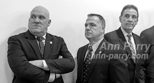 Mineola, NY, USA. March 5, 2012. At Nassau County Legislature meeting when legislators vote to confirm Thomas Dale as Police Commissioner and to consolidate 8 police precincts into 4, are, L-R, Nassau PBA President JAMES CARVER, PBA's Sergeant-at-arms JAMES McDERMOTT, and President of Superior Officers (SOA) GARY LEARNED.