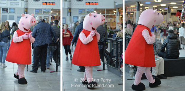Garden City, NY, USA. Nov. 24, 2018. Peppa Pig walks in atrium of Long Island Festival of Trees holiday event, an annual family fun at the Cradle of Aviation Museum on Long Island. All proceeds raised benefit the non-profit charity Cerebral Palsy Association of Nassau County, Inc.