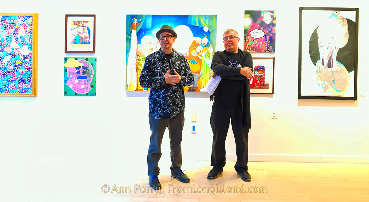 Huntington, NY, USA. March 29, 2019. L-R, Juror Benjamin Owens and Huntington Arts Council Executive Director Marc Courtade address visitors during HAC Reception for Lowbrow Art Exhibition.