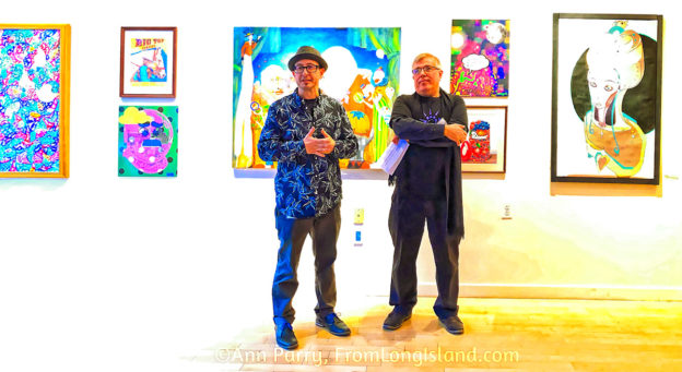 Huntington, NY, USA. March 29, 2019. L-R, Juror Benjamin Owens and Huntington Arts Council Executive Director Marc Courtade address visitors during HAC Opening Reception for Bright Colors Bold Strokes, Creations of Lowbrow Art Exhibition.