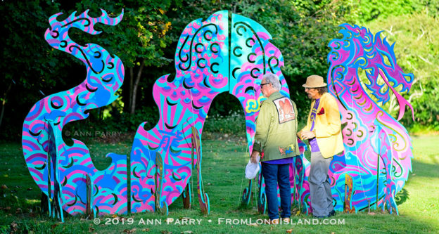 Roslyn, New York, U.S. September 13, 2019. L-R, Dr. HARVEY MANES and GARY BARAT discuss large outdoor dragon Animodules at Animodules at ANIMODULES Agents of Peace exhibit Farewell Reception and Founders' talk by Gary Barat and Chandri Barat at the Nassau County Museum of Art's Manes Art & Education Center, named for Dr. Manes, who spearheaded the exhibit.