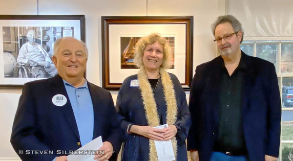 Manhasset, NY, U.S., Feb. 1, 2020. L-R, Board Member DAVE WOLLIN, 1st Place winner ANN PARRY, and Judge HAROLD NAIDEAU pose at The Art Guild exhibition Everything Old is New Again, at Elderfields Preserve. (© 2002 Steven Silberstein)