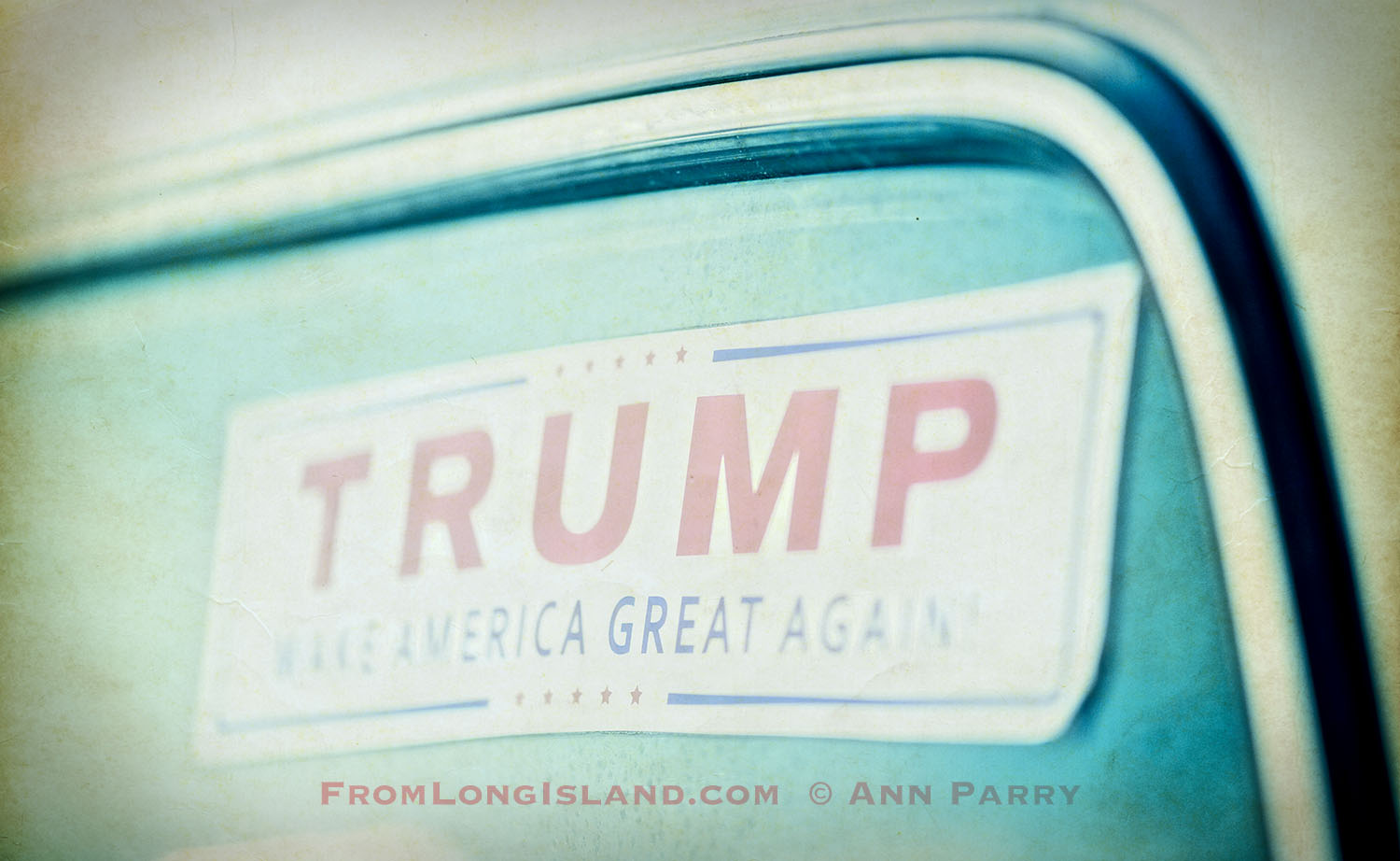 Bellmore, New York, USA. August 11, 2017. At the Bellmore Friday Night Car Show, a Trump Make American Great Again sticker is in rear windshield of a white pickup truck.