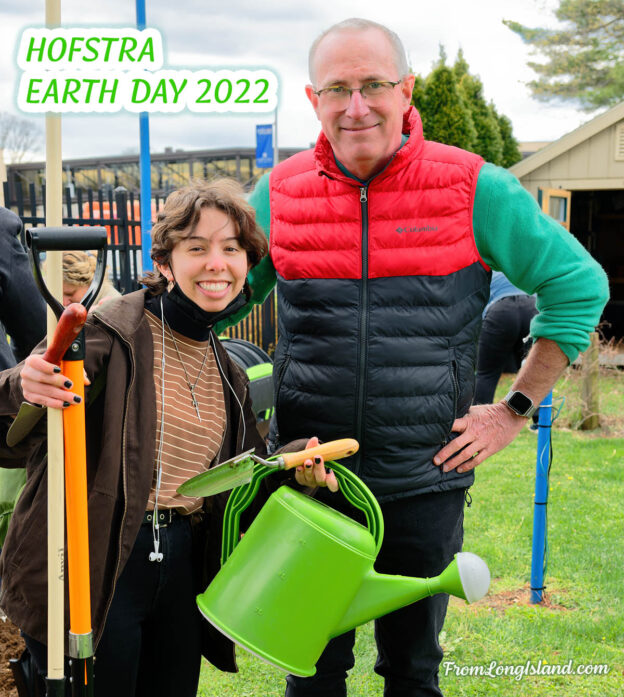 Hempstead, N.Y., U.S. April 18, 2022. L-R, student 'BADGER' and Prof. BRET BENNINGTON take quick break for photo at 'EARTH DAY: Help Plant a Native Pollinator Garden' at Student Garden at Stuyvesant Hall in Hofstra University.