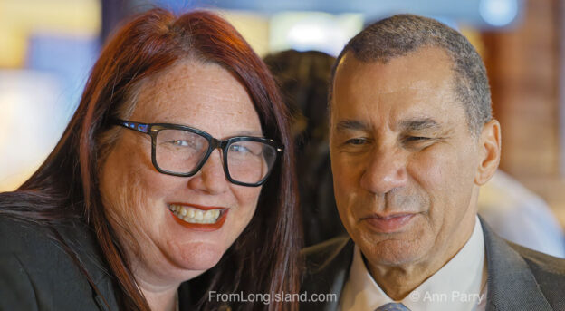 Merrick, New York, U.S. April 17, 2024. R-L, Former NY Governor DAVID PATERSON, Senior Vice President of Las Vegas Sands Corp., and LAUREN CORCORAN-DOOLIN, also with Sands, pose for photo before Paterson speaks at Merrick Chamber of Commerce general meeting, about Sands' effort to build casino hotel at site of Nassau Coliseum in Nassau Hub. (© 2024 Ann Parry, annparry.com)